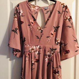 Pink Floral Romper with open back.